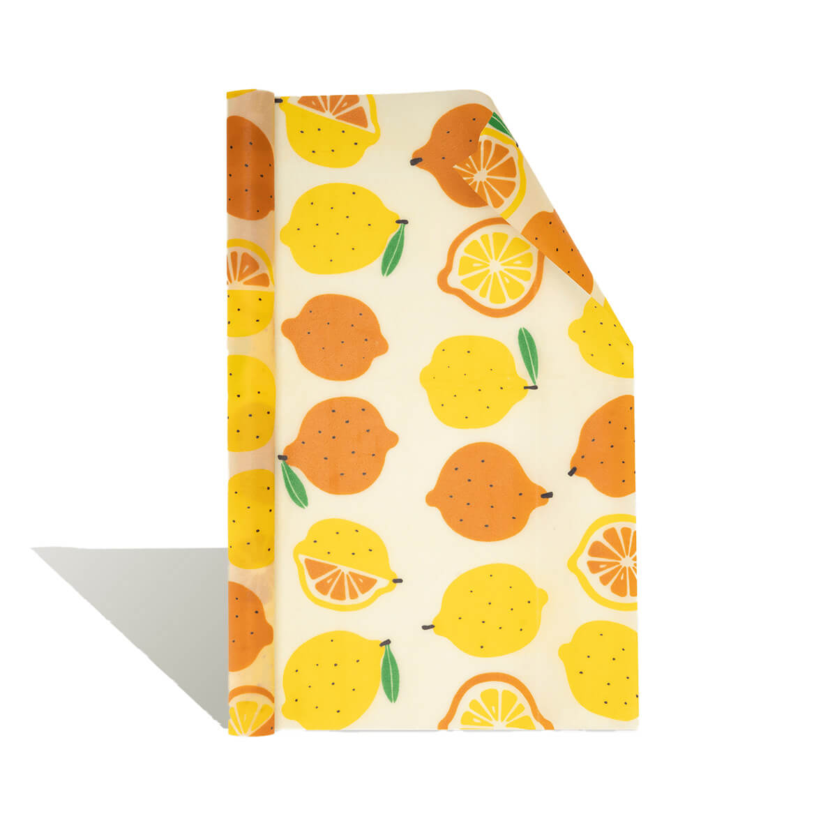 Bunte Bienenwachstuch-Rolle mit Zitronen- und Orangenmotiv – nachhaltige Alternative zu Frischhaltefolie.